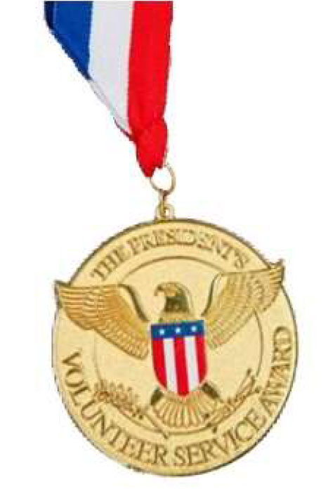 The President&rsquo;s Volunteer Service Award gold medal on a red, white and blue ribbon.